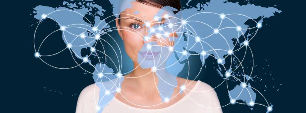 Portrait of young woman standing in front of big world map and looking at camera. Server locations and actual online connections are displayed on virtual map. Hosting provider concept